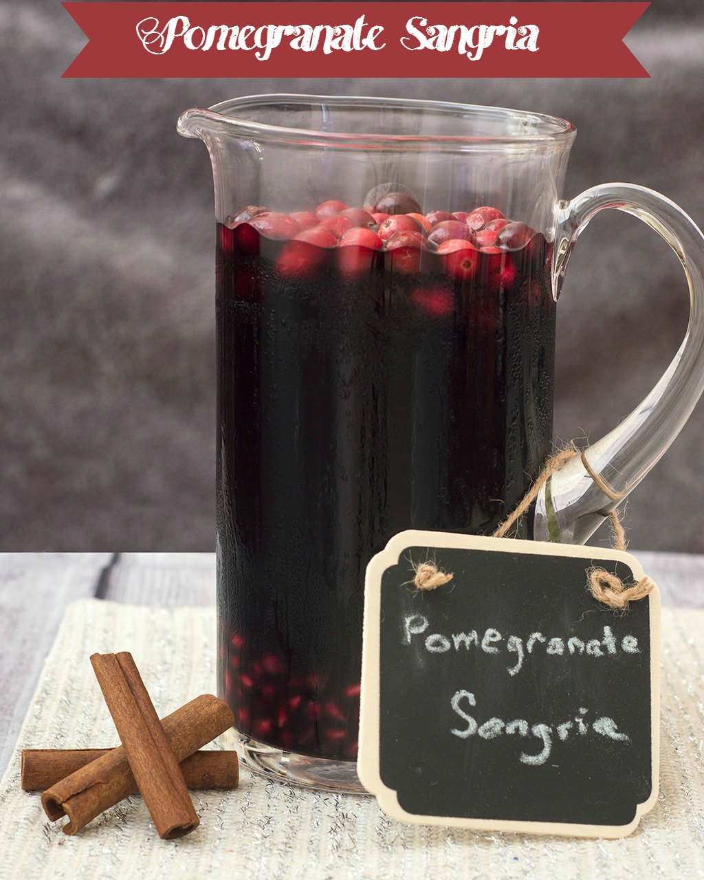 Pomegranate sangria combines fruity red wine with pomegranate and cranberry, with cinnamon for a hint of spice. Make a large batch a day ahead for a winning party cocktail! #SundaySupper TheRedheadBaker.com