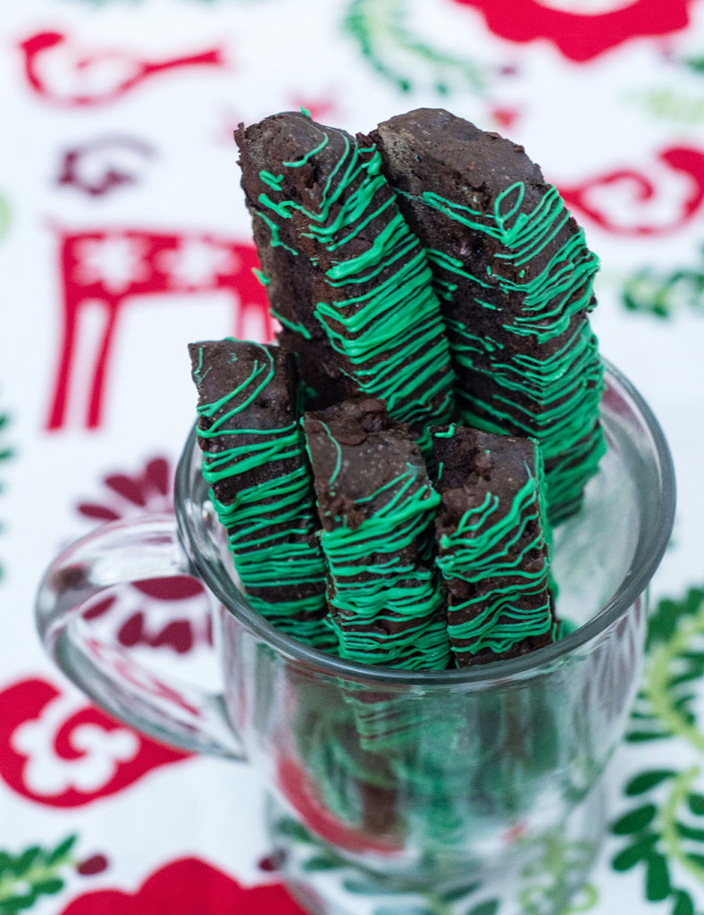 Italian-style chocolate mint biscotti is the perfect accompaniment for your afternoon cup of coffee! This cookie is flavored with dark chocolate cocoa powder and mint-flavored chocolate morsels. TheRedheadBaker #WhatsBaking
