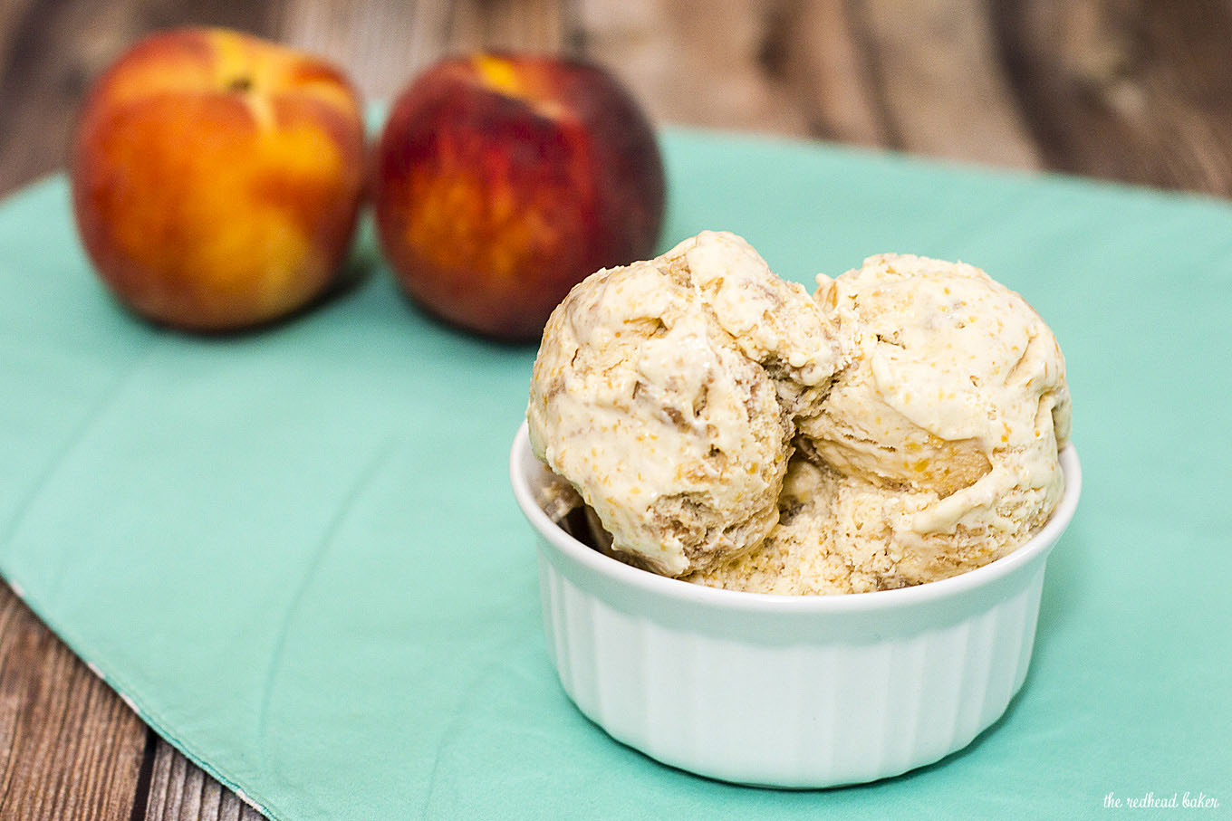 This peach pie ice cream is flavored with roasted peaches and has a swirl of graham cracker crumb crust, and no ice cream maker is required to make it! #SundaySupper
