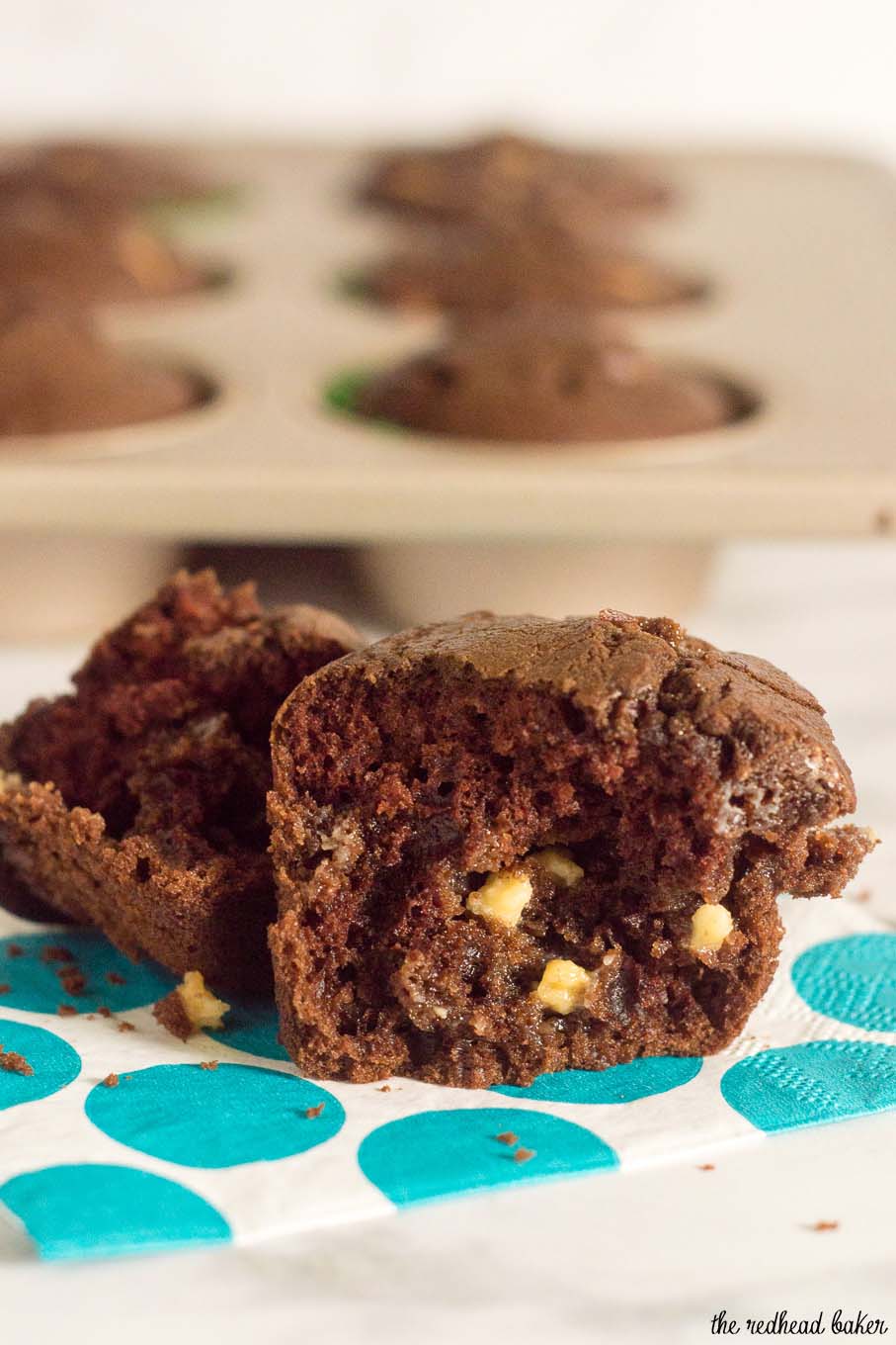 Double chocolate muffins pack a double punch -- rich semisweet chocolate in the muffin batter, and white chocolate chips mixed in. Are they for breakfast or dessert? You decide! #Choctoberfest