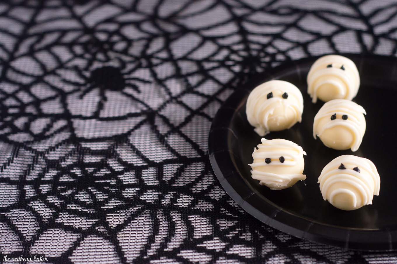 Boo! Scare your Halloween dinner or party guests with these easy-to-make white chocolate mummy truffles made with white chocolate ganache! #ProgressiveEats