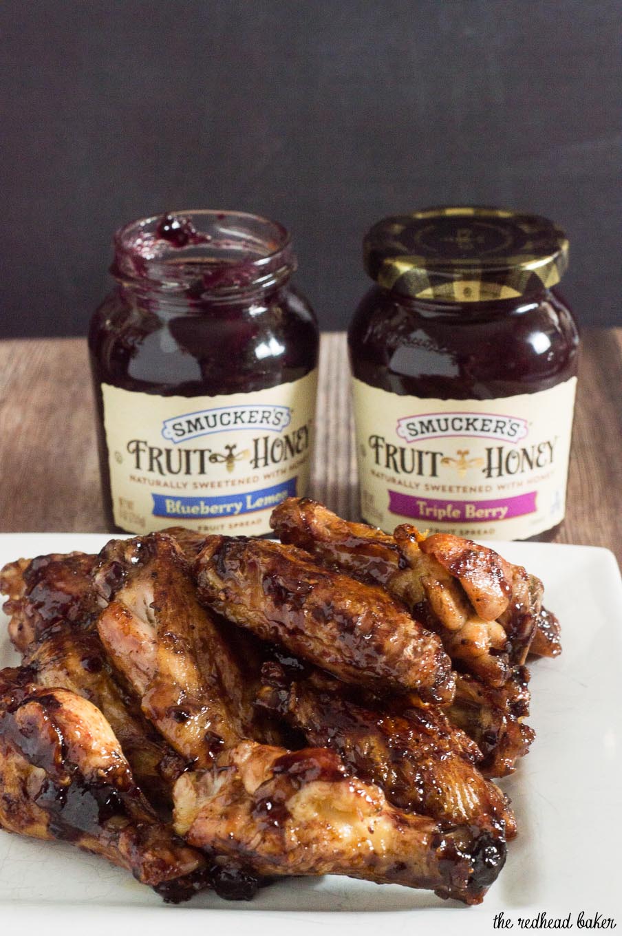 These spicy-sweet chicken wings are coated in a glaze of Smucker's Fruit & Honey Blueberry Lemon Fruit Spread, shallot, vinegar and chipotle chili powder. #EasyHolidayEats #ad