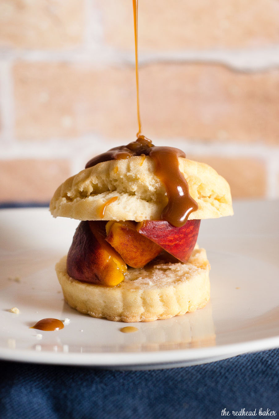 Like the classic strawberry version, peach shortcake combines a sweet biscuit with brandied brown-sugar peaches, and is topped off with a drizzle of salted caramel sauce. #CookoutWeek