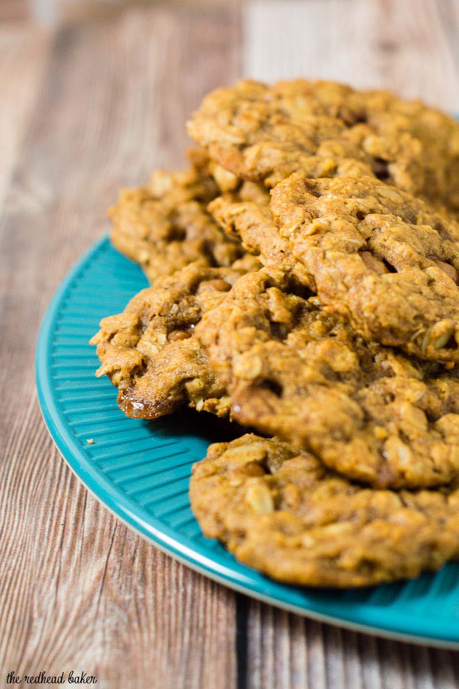 These chewy pumpkin oatmeal cookies are flavored with spices and nutty browned butter, and are loaded with caramel chips.  #PumpkinWeek