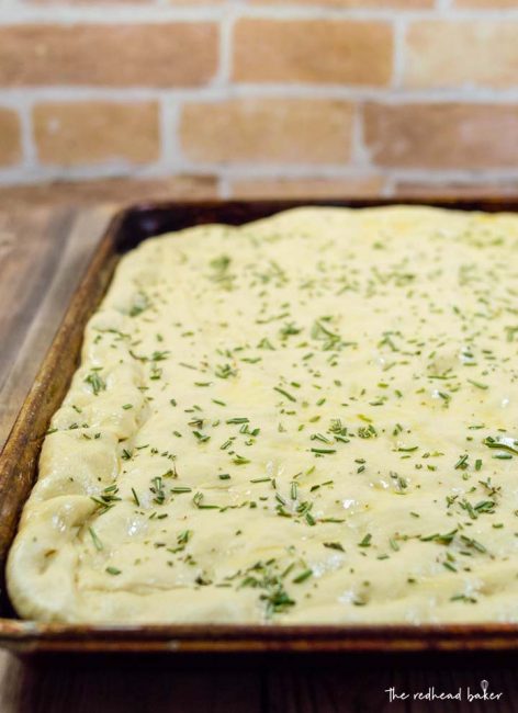 Focaccia is an Italian flat bread similar to the crust of Sicilian pizza. It is moist, chewy, and topped with savory rosemary. 