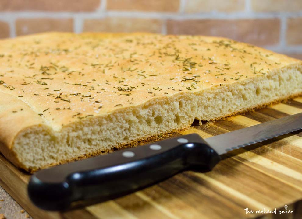 Focaccia is an Italian flat bread similar to the crust of Sicilian pizza. It is moist, chewy, and topped with savory rosemary. 