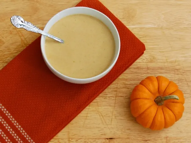 Creamy pumpkin soup with hints of cinnamon and ginger is my favorite comfort food on a chilly night. TheRedheadBaker.com