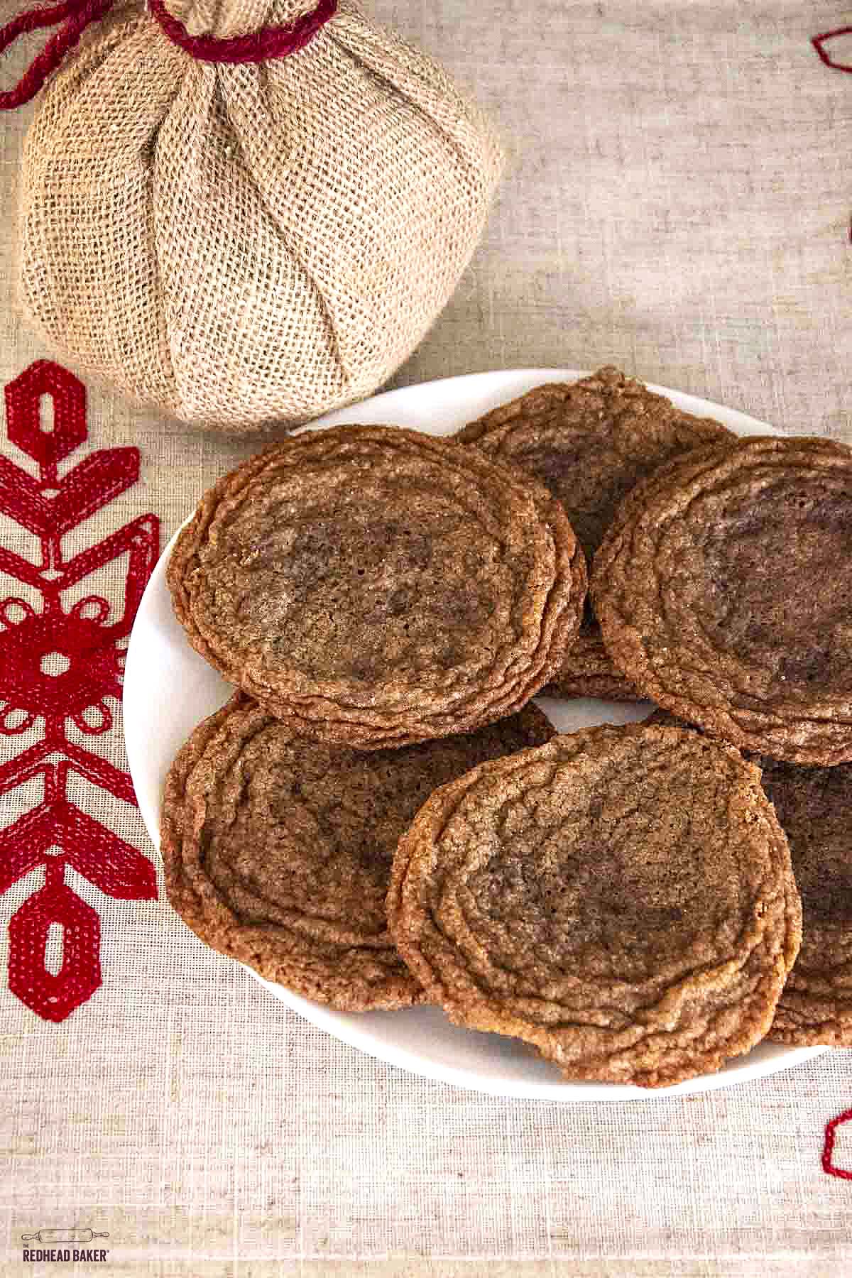 Six caramel nutella cookies on a white plate. 