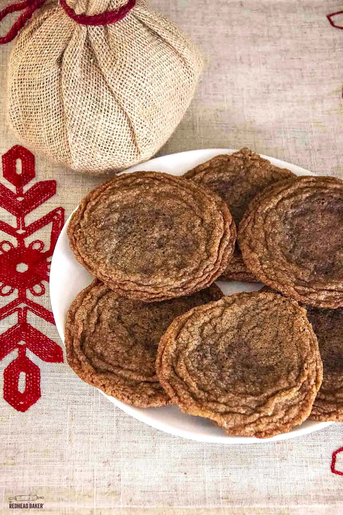 Six caramel nutella cookies on a white plate.