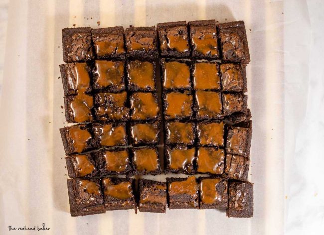 An overhead view of 36 squares of salted caramel brownies