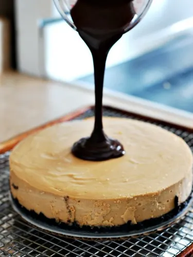 Peanut Butter Cheesecake with Nutella Ganache by @TheRedheadBaker