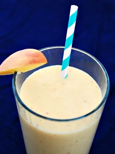 Peach Mango Breakfast Smoothie by @TheRedheadBaker