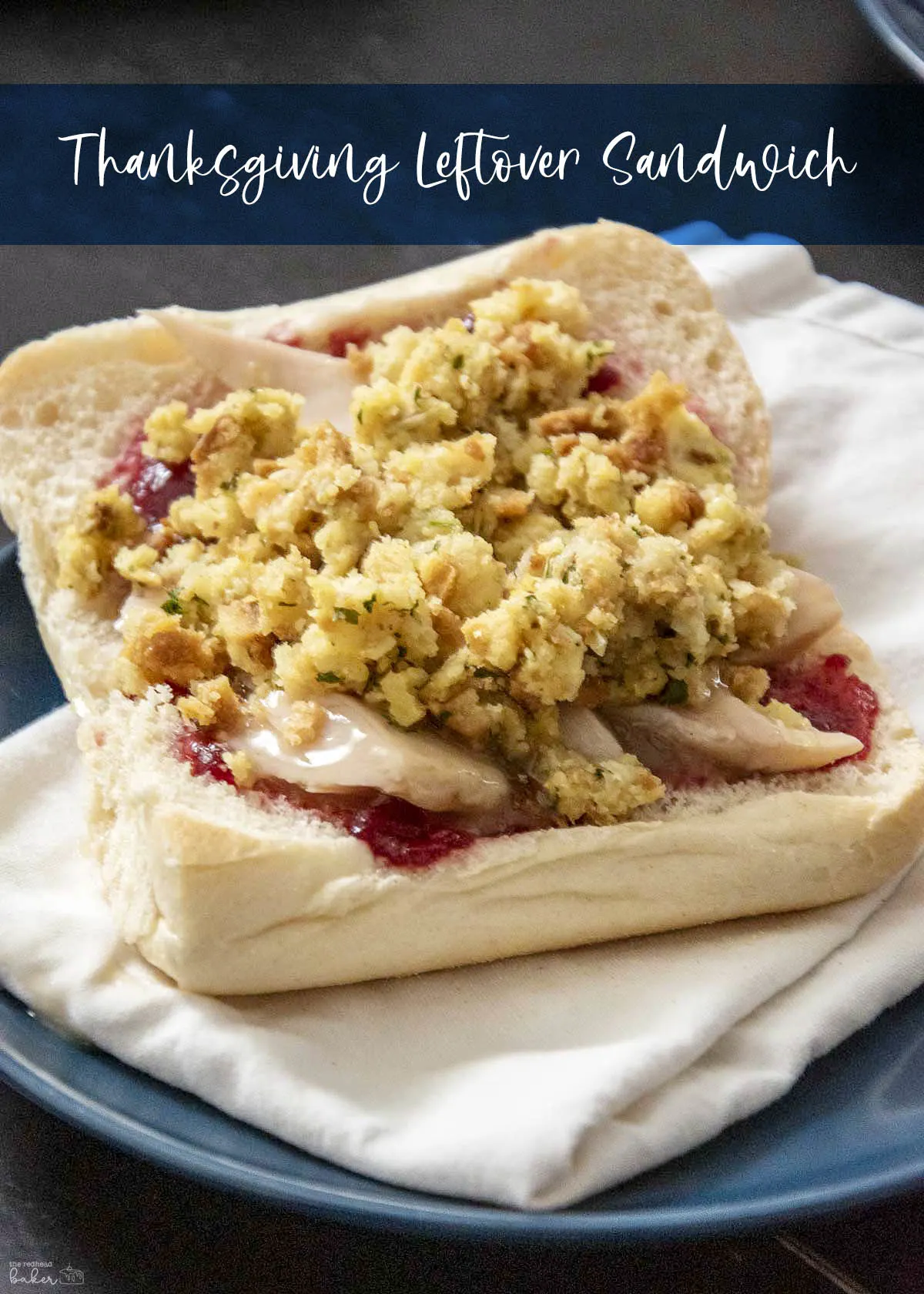 A Thanksgiving leftover sandwich on a white napkin.