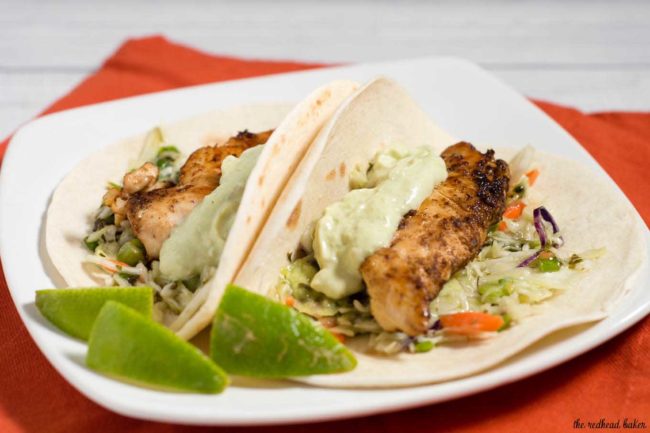 Chicken tacos are spiced with ancho chile powder and topped with cilantro slaw and avocado cream. This delicious meal is ready in under 30 minutes!