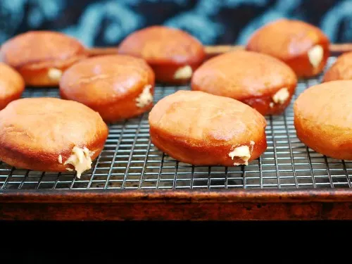 Chocolate-Glazed Peanut Butter-Stuffed Donuts #ChocPBDay | theredheadbaker.com