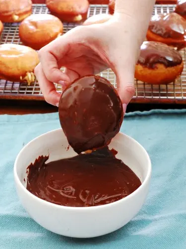 Chocolate-Glazed Peanut Butter-Stuffed Donuts #ChocPBDay | theredheadbaker.com