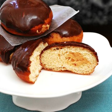 Chocolate-Glazed Peanut Butter-Stuffed Donuts #ChocPBDay | theredheadbaker.com