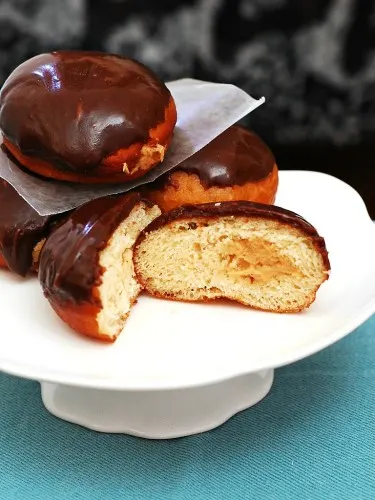 Chocolate-Glazed Peanut Butter-Stuffed Donuts #ChocPBDay | theredheadbaker.com