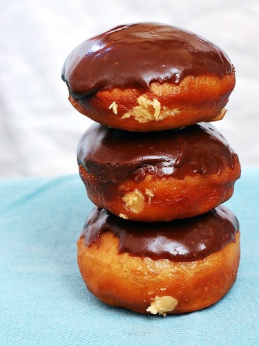 Chocolate-Glazed Peanut Butter-Stuffed Donuts #ChocPBDay | theredheadbaker.com