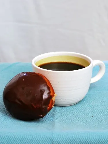 Chocolate-Glazed Peanut Butter-Stuffed Donuts #ChocPBDay | theredheadbaker.com