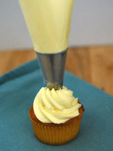 Vanilla Cupcakes with Lemon Curd Filling and Lemon Buttercream #SundaySupper #GalloFamily | theredheadbaker.com