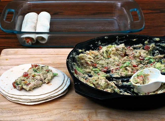 Chicken verde enchiladas are a fast, delicious way to use up leftover chicken. Add a little fiesta to your #WeekdaySupper! theredheadbaker.com