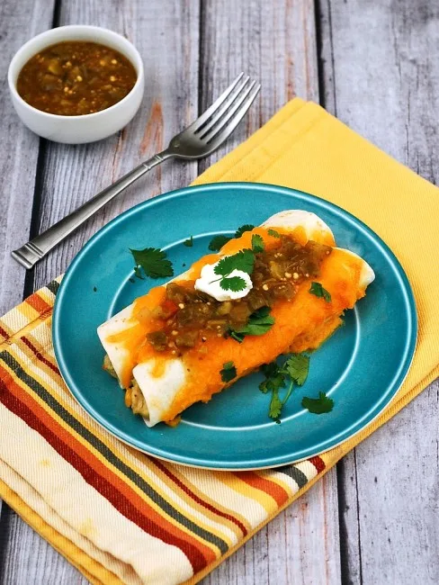 Chicken verde enchiladas are a fast, delicious way to use up leftover chicken. Add a little fiesta to your #WeekdaySupper! theredheadbaker.com