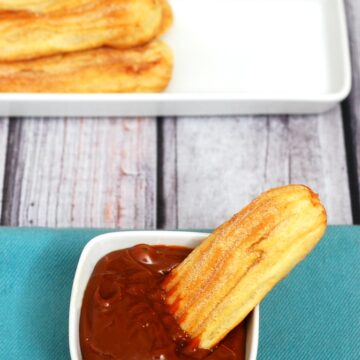 Snack on baked churros dipped in dulce de leche this Cinco de Mayo! | theredheadbaker.com