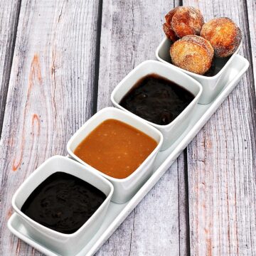 #BrunchWeek continues with sweet sugar-covered fried donut holes, served with three dipping sauces: caramel, chocolate, and blackberry. Bet you can't stop at just one! theredheadbaker.com