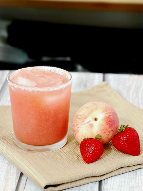 Set aside some fresh seasonal fruit for these strawberry-peach margaritas. They are light and refreshing, perfect for sipping on a warm summer night!