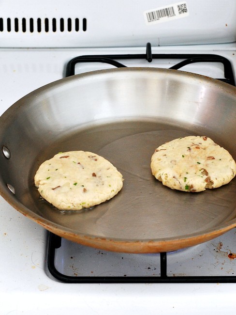 Scottish tattie scones, aka potato scones, resemble pancakes more than typical scones. They combine potatoes, flour, and butter and are sauteed on a griddle. #BrunchWeek theredheadbaker.com