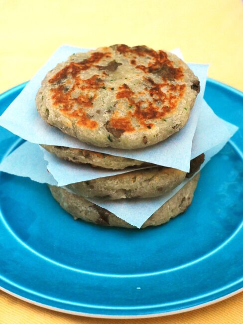 Scottish tattie scones, aka potato scones, resemble pancakes more than typical scones. They combine potatoes, flour, and butter and are sauteed on a griddle. #BrunchWeek theredheadbaker.com