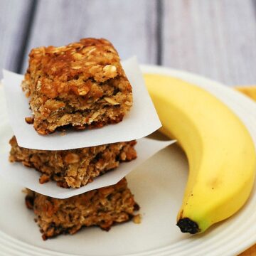 Use up an overripe banana in these tender, delicious banana-oatmeal squares. These treats are low-fat, so it's okay to eat two! theredheadbaker.com #CLBLogger