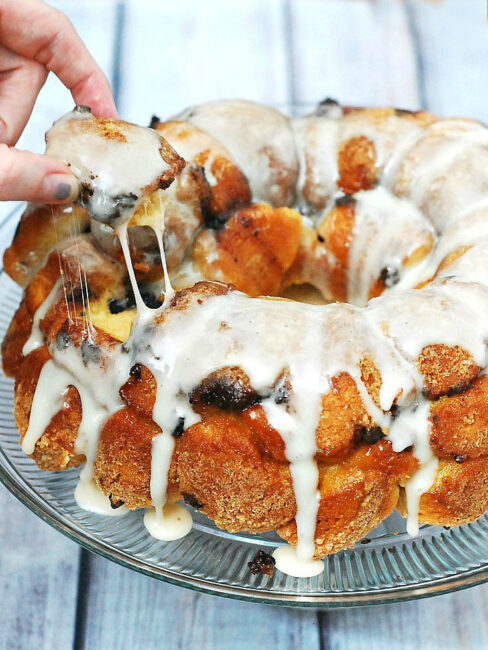 Nothing says summer snack likes s'mores monkey bread! Little balls of sweet bread are coated in graham cracker crumbs and baked with layers of chocolate and marshmallow. #TwelveLoaves theredheadbaker.com