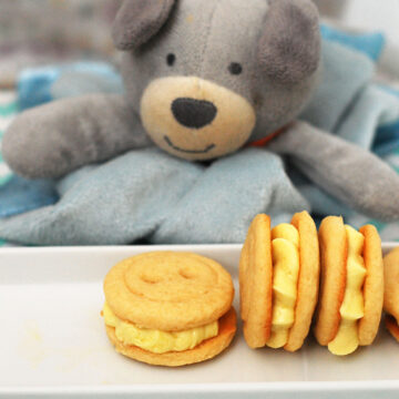 Babies are cute as a button, and so are these adorable little button cookies sandwiched with lemon buttercream! Serve them as a sweet ending to a baby shower. TheRedheadBaker.com