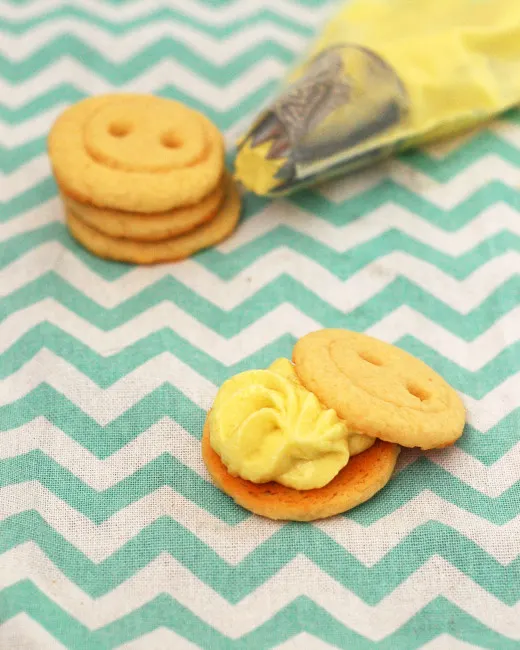 Babies are cute as a button, and so are these adorable little button cookies sandwiched with lemon buttercream! Serve them as a sweet ending to a baby shower. TheRedheadBaker.com