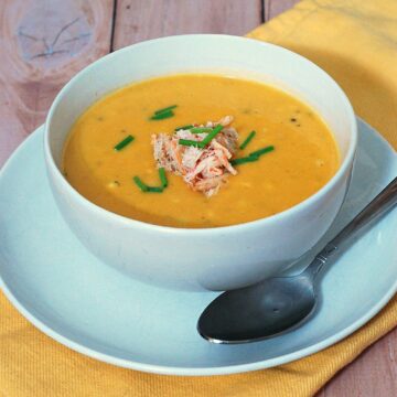 Soup in the summer? Sweet corn shines in this easy, light-but-satisfying summer soup recipe, topped with succulent crabmeat. #SundaySupper TheRedheadBaker.com