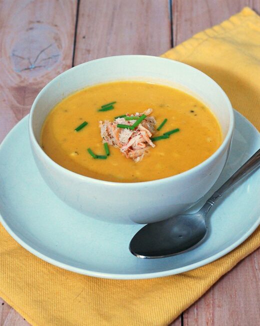 Soup in the summer? Sweet corn shines in this easy, light-but-satisfying summer soup recipe, topped with succulent crabmeat. #SundaySupper TheRedheadBaker.com