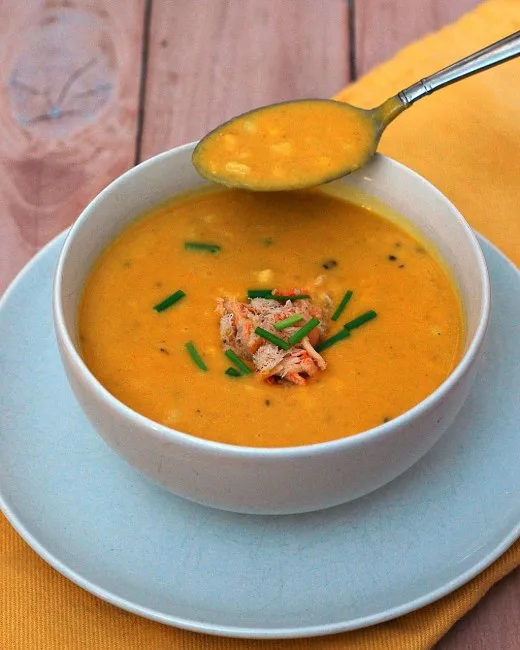 Soup in the summer? Sweet corn shines in this easy, light-but-satisfying summer soup recipe, topped with succulent crabmeat. #SundaySupper TheRedheadBaker.com
