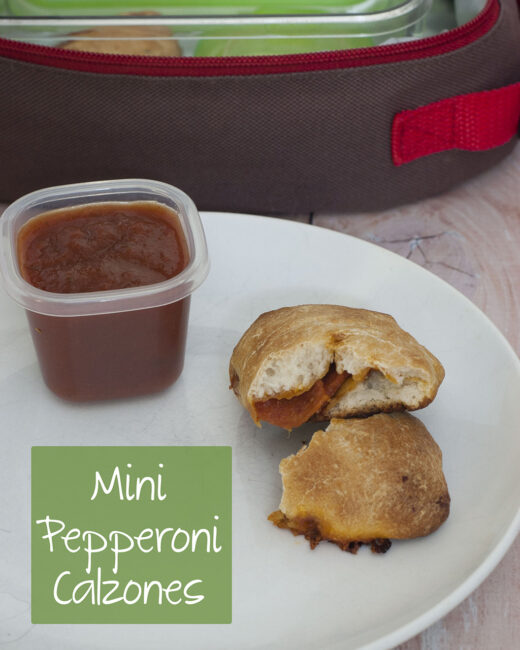 You'll be parent of the year when you send your kids back to school with mini pepperoni calzones. They're easy to make in bulk and freeze. #SundaySupper TheRedheadBaker.com