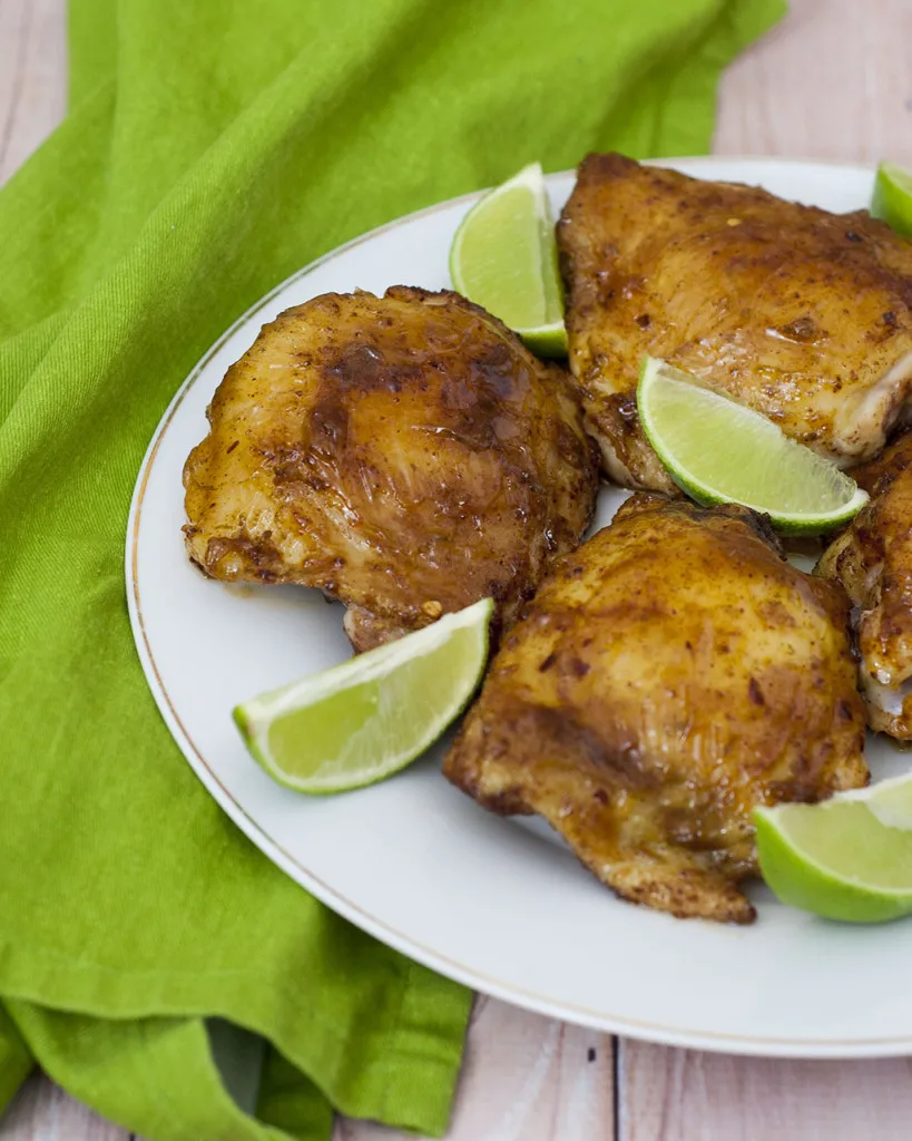 Pineapple juice, tequila and two kinds of chili powder add big flavors to moist chicken thighs. Shred leftovers (if there are any!) for tacos the next night. #CLBlogger TheRedheadBaker.com