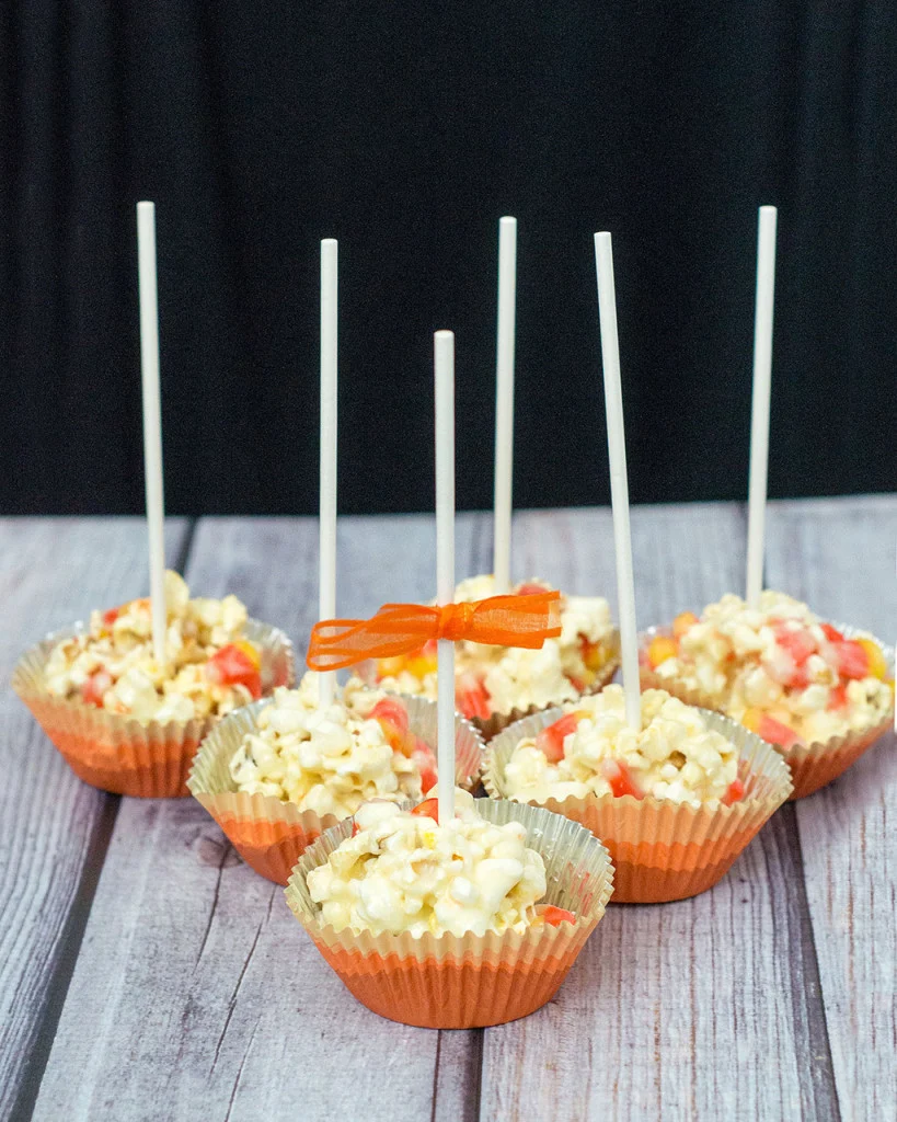 Need a last-minute, no-bake Halloween treat? Try these 5-ingredient candy corn popcorn balls! They're sweet and salty and perfect for all ages! TheRedheadBaker@gmail.com