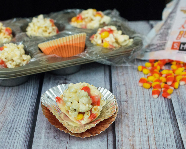 Need a last-minute, no-bake Halloween treat? Try these 5-ingredient candy corn popcorn balls! They're sweet and salty and perfect for all ages! TheRedheadBaker.com