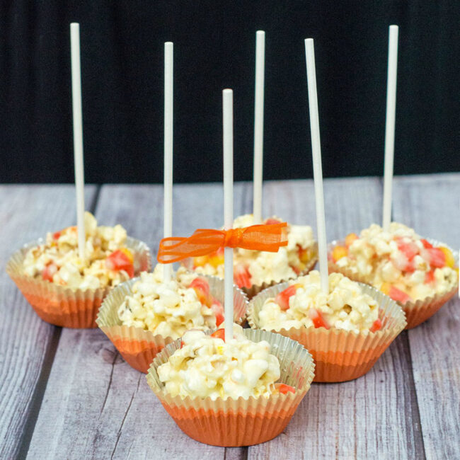 Need a last-minute, no-bake Halloween treat? Try these 5-ingredient candy corn popcorn balls! They're sweet and salty and perfect for all ages! TheRedheadBaker@gmail.com