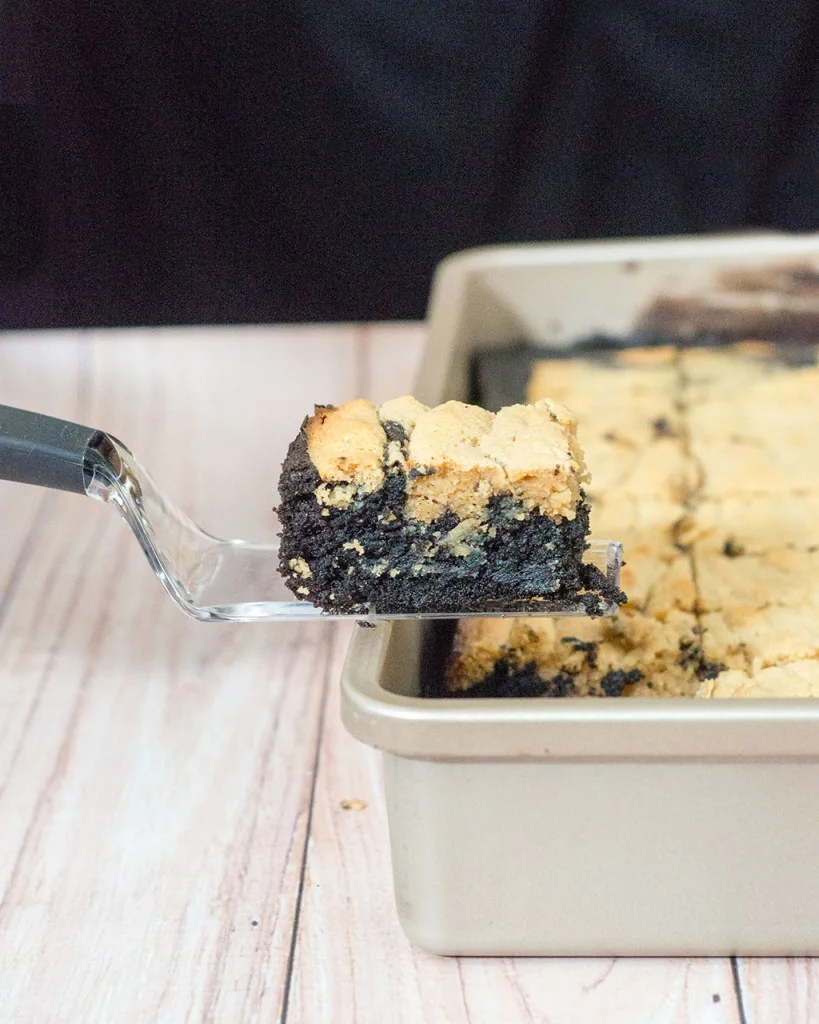 Creamy peanut butter cheesecake swirled with fudgy dark chocolate brownies makes for one decadent dessert. #OXOGoodCookie TheRedheadBaker.com