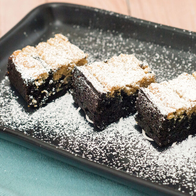 Creamy peanut butter cheesecake swirled with fudgy dark chocolate brownies makes for one decadent dessert. #OXOGoodCookie TheRedheadBaker.com