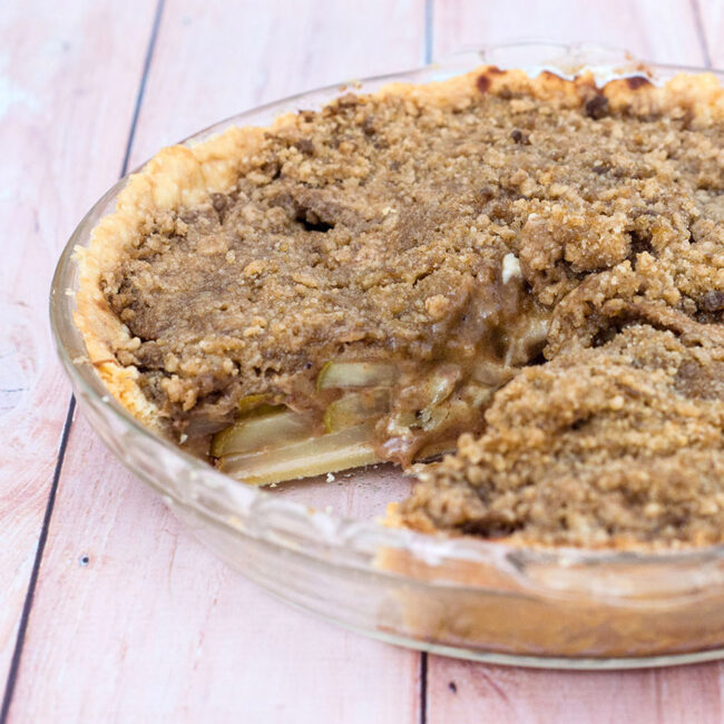 Looking for a change from classic apple or pumpkin pie? Try this delicious spiced pear pie with hazelnut crumb topping. Serve slightly warm with a scoop of vanilla ice cream. TheRedheadBaker.com