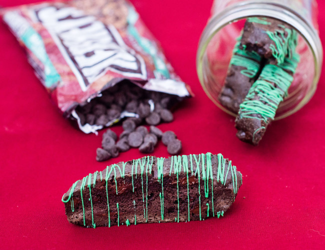 Italian-style biscotti is the perfect accompaniment for your afternoon cup of coffee! This cookie is flavored with dark chocolate cocoa powder and mint-flavored chocolate morsels. TheRedheadBaker #WhatsBaking