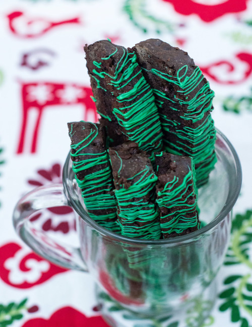 Italian-style biscotti is the perfect accompaniment for your afternoon cup of coffee! This cookie is flavored with dark chocolate cocoa powder and mint-flavored chocolate morsels. TheRedheadBaker #WhatsBaking