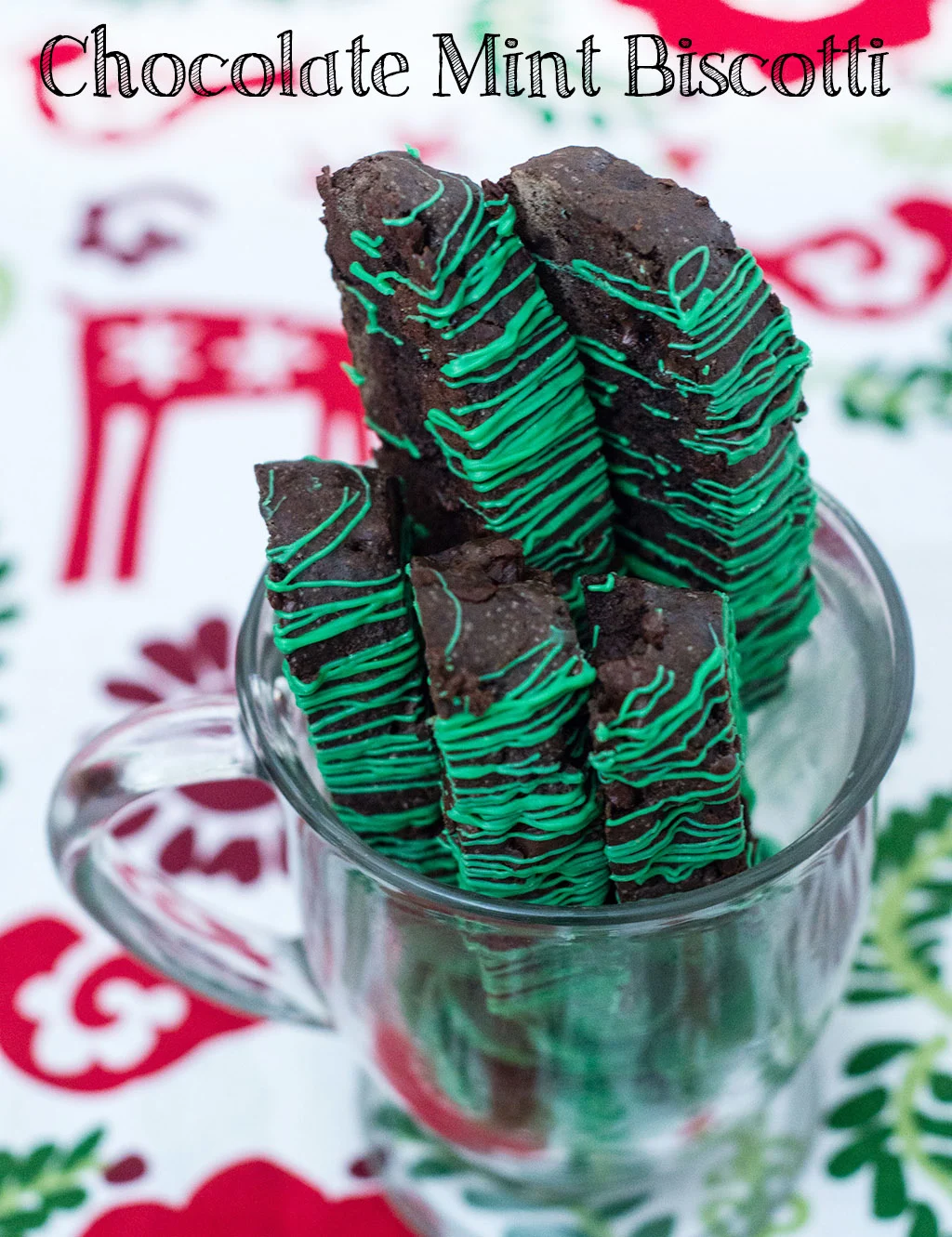 Italian-style chocolate mint biscotti is the perfect accompaniment for your afternoon cup of coffee! This cookie is flavored with dark chocolate cocoa powder and mint-flavored chocolate morsels. TheRedheadBaker.com #WhatsBaking